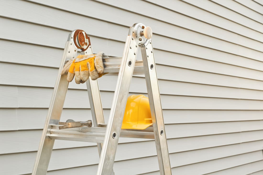ladder by the home siding wall