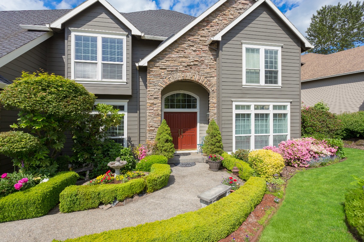 fiber cement siding on a house exterior with stucco stone siding mixed