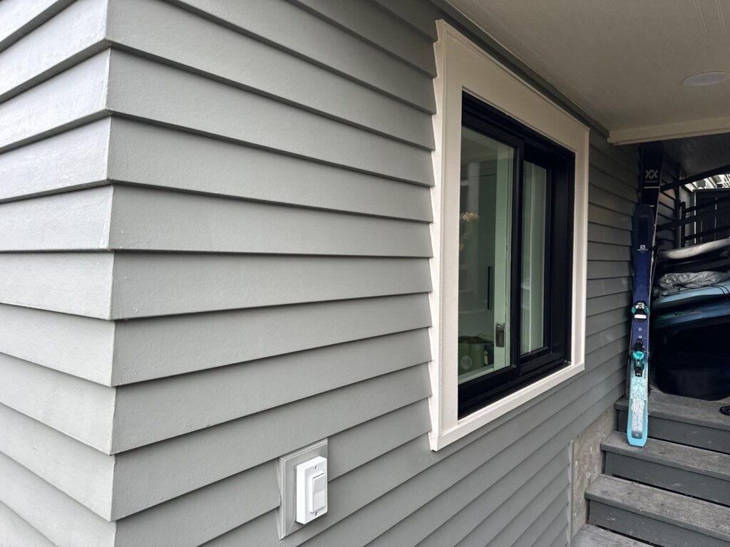 James Hardie Artisan Prime Smooth siding with 4-inch exposure and white trim on a Seattle home