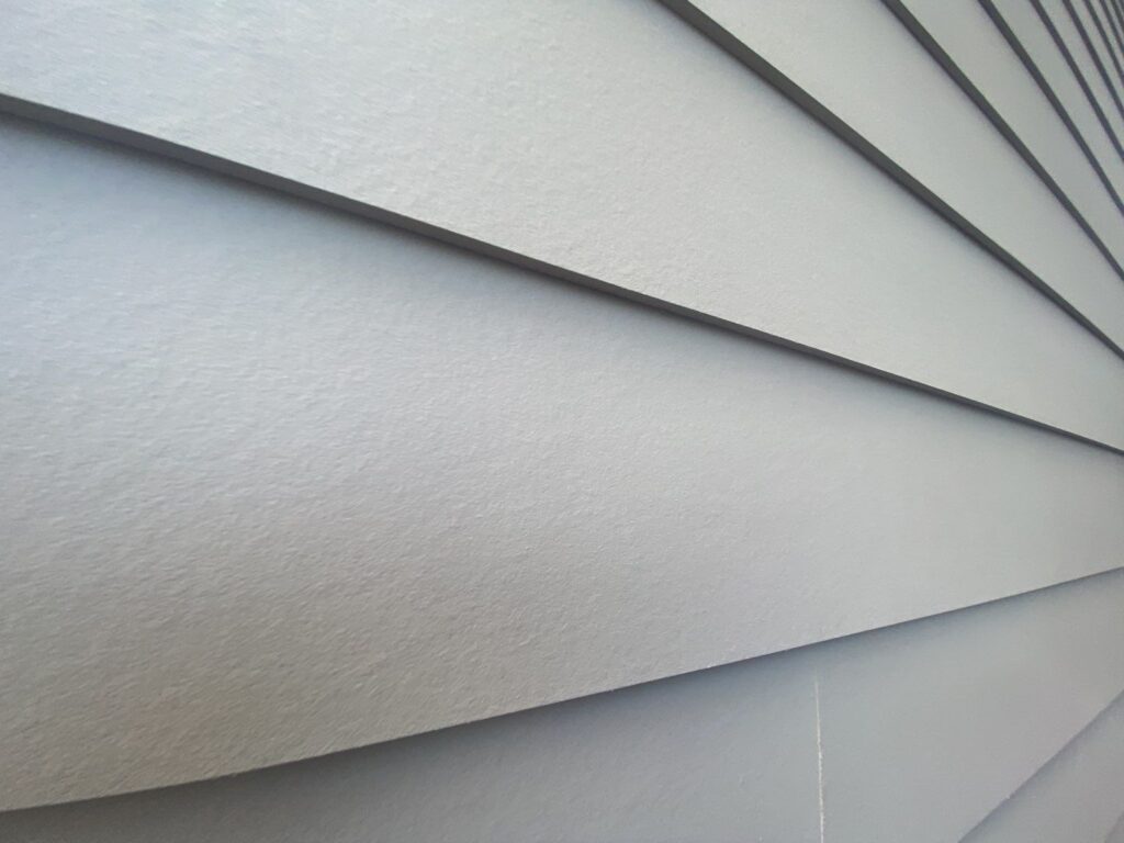 fiber cement siding planks lap siding installed on the house wall