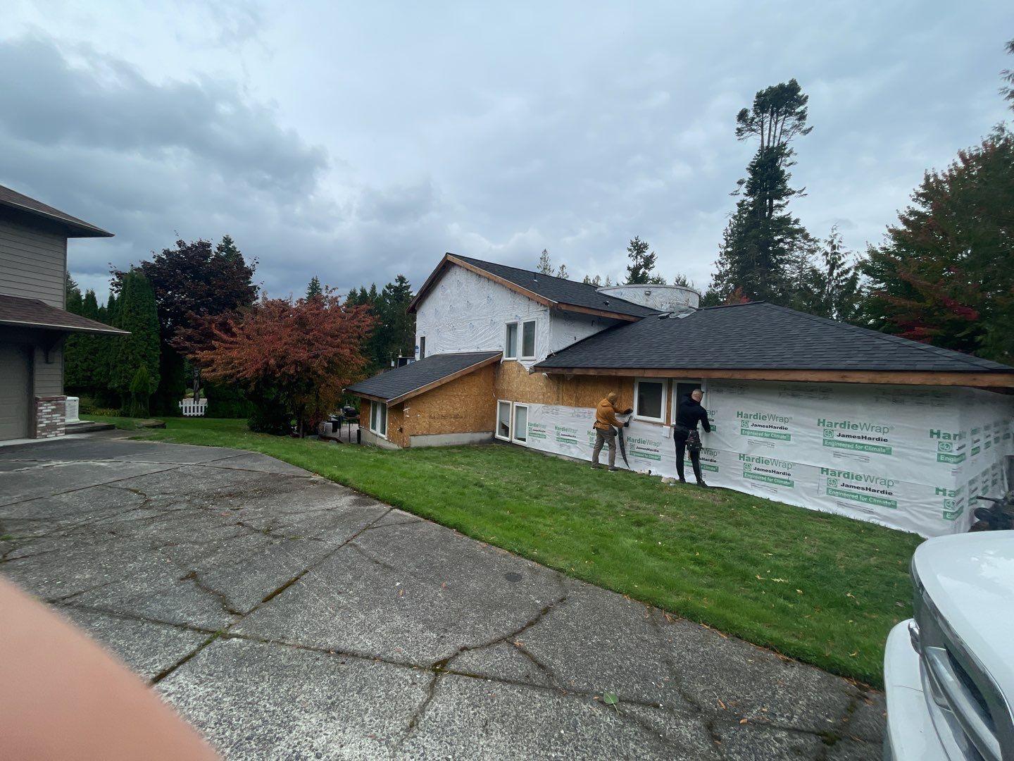 home wrapped in hardiewrap jameshardie paper siding team crew in pacific exterior home remodeling and installing hardiewrap paper