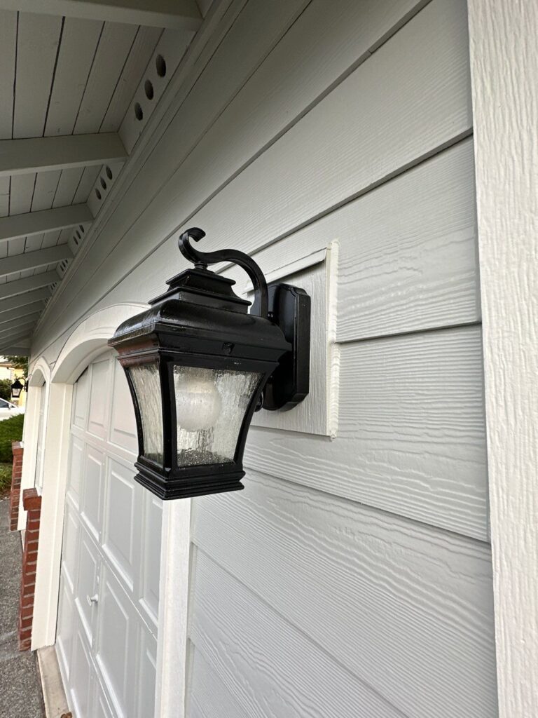 light blocks with hardie cedarmill primed lap siding around light, garage doors and soffit