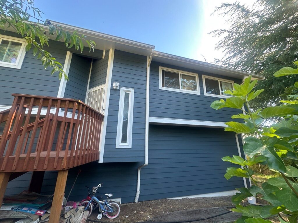 tall window and hardieplank lap siding installed on house walls