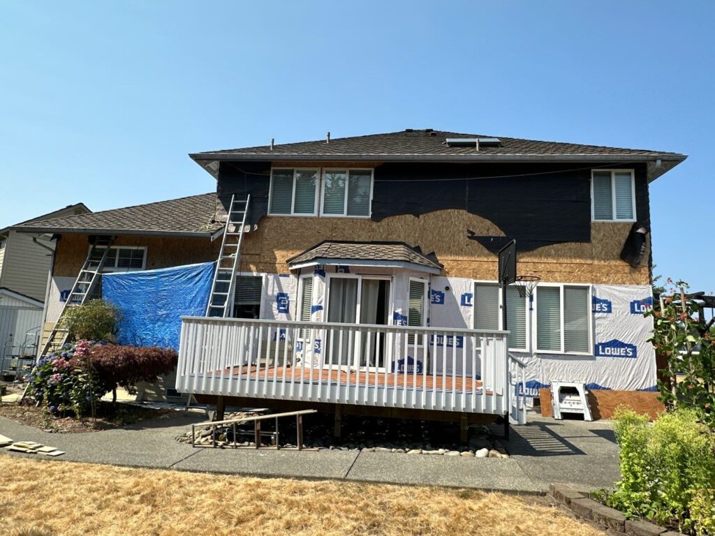 work in progress siding demo and install weather barrier paper