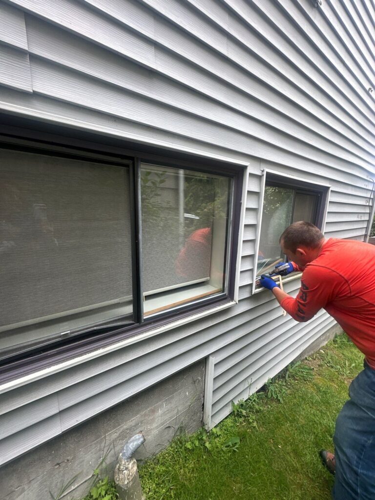 siding installation crew team removing old siding and old windows in Lake Stevens Washington