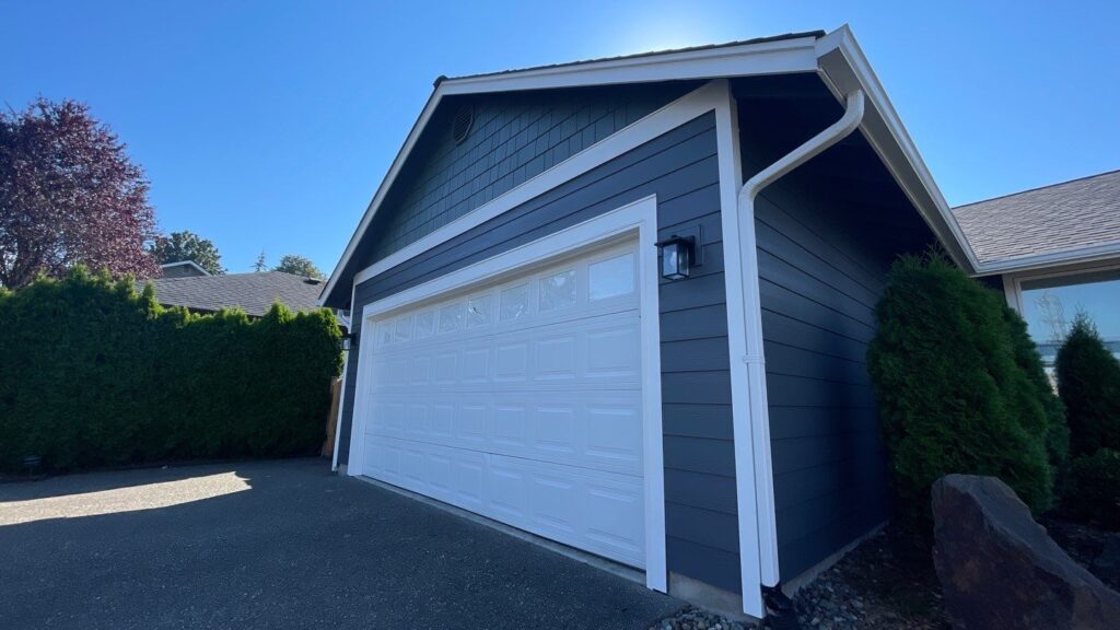 shingle above garage and lap siding with withe trim details