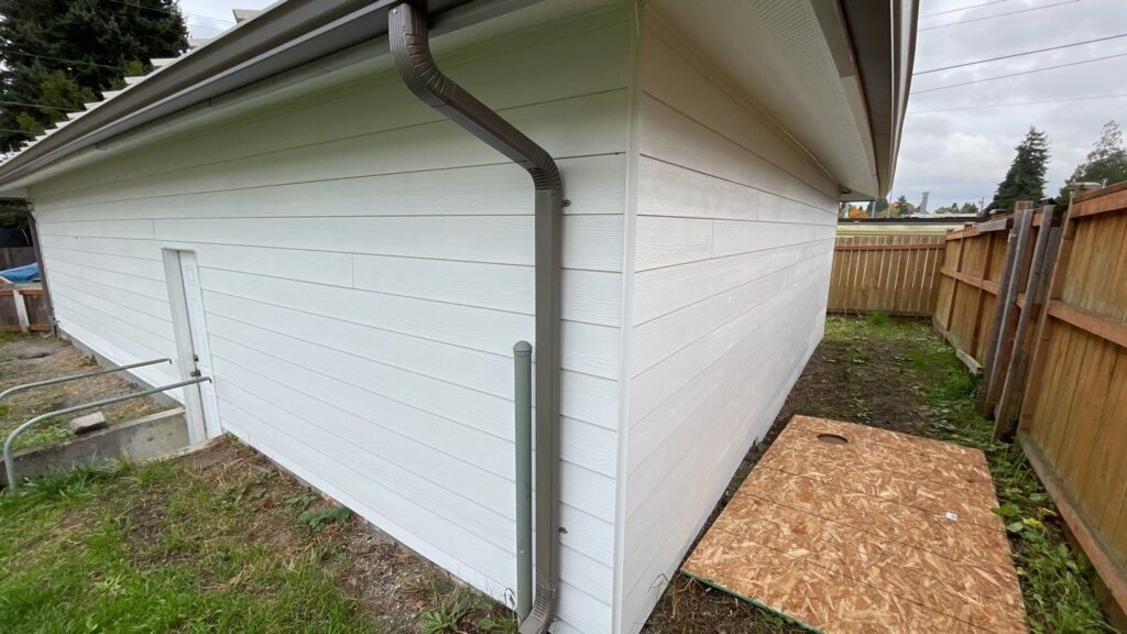 Lap siding installation with flashing and trim details