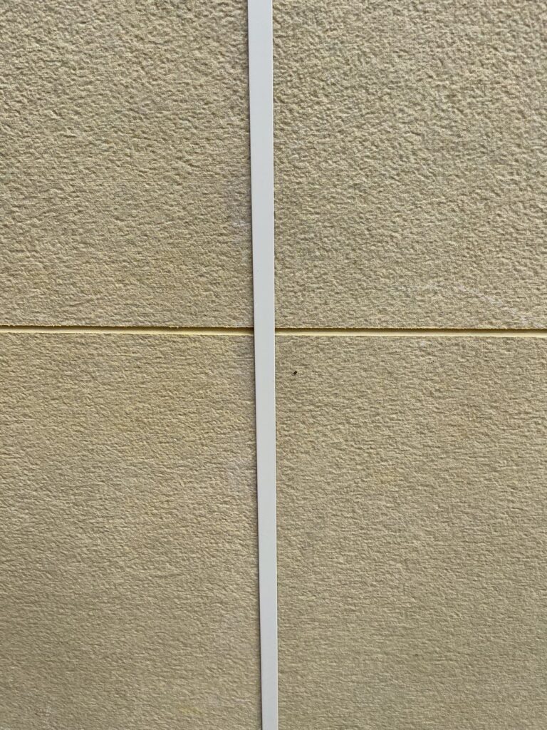 Smooth fiber cement panel texture with horizontal seam and vertical trim detail in Everett, WA