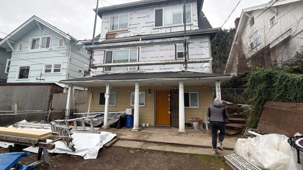 Seattle University District home with weather barrier installed during HardiePlank lap siding installation project