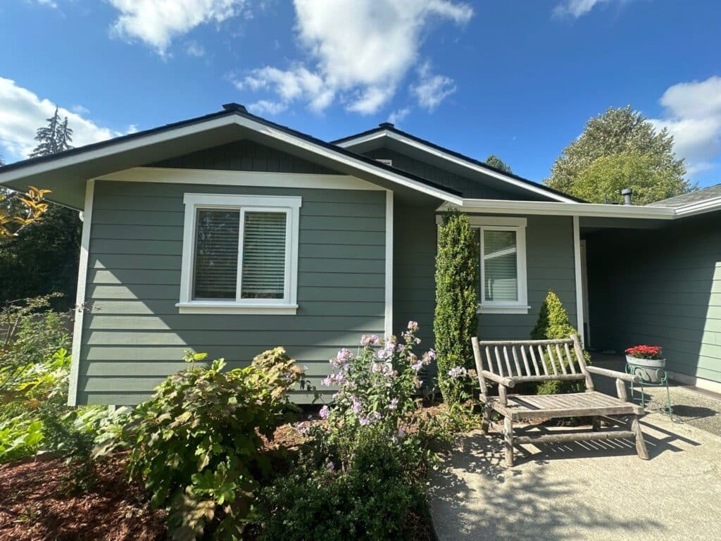 Old T1-11 siding repair with OSB plywood before Hardie installation