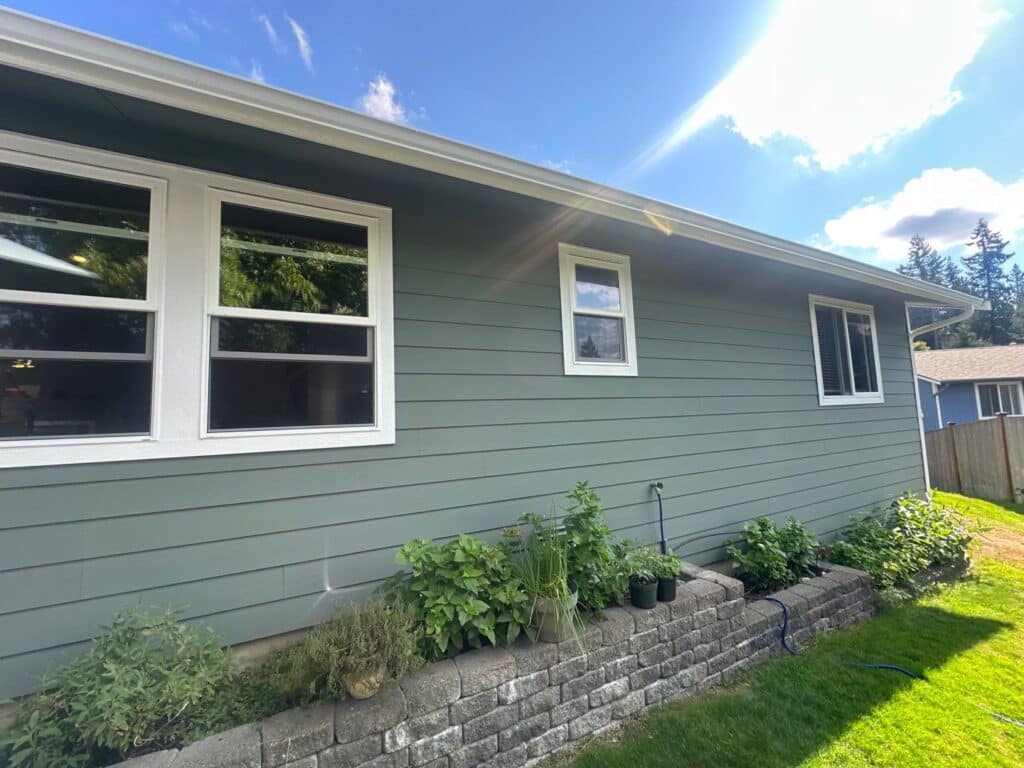 Old T1-11 siding repair with OSB plywood before Hardie installation