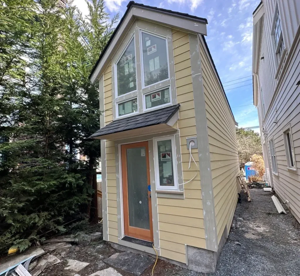 Smooth Allura 5/4x4 outside corners, window trim, and door trim installed with James Hardie siding