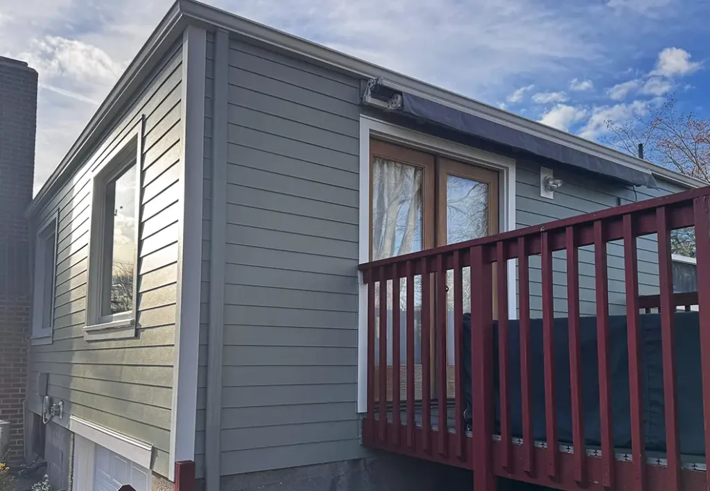 Sherwin-Williams SuperPaint, Evergreen Fog SW 9130 for the siding and Alabaster SW 7008 for the trim finish on Greenwood, Seattle, WA siding remodel