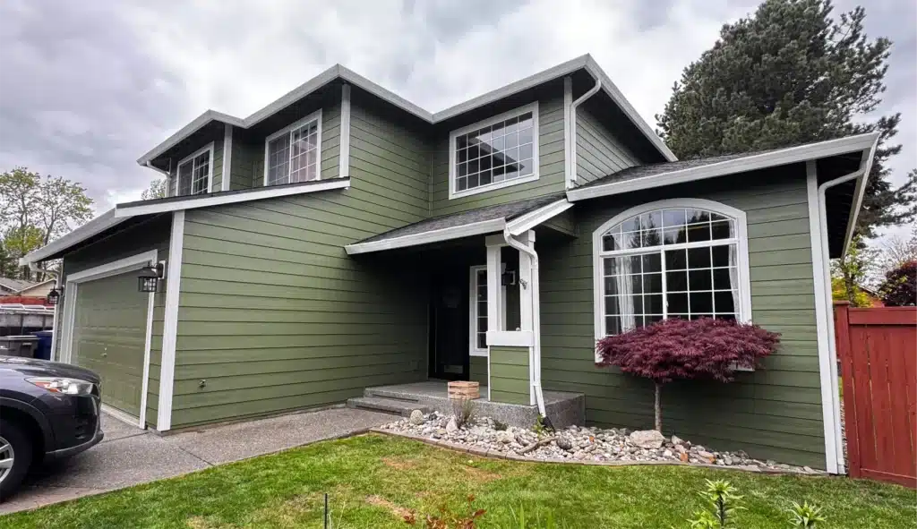 Prime rustic Hardie 5/4x4 outside corners, window trim, and door trim installed with James Hardie siding