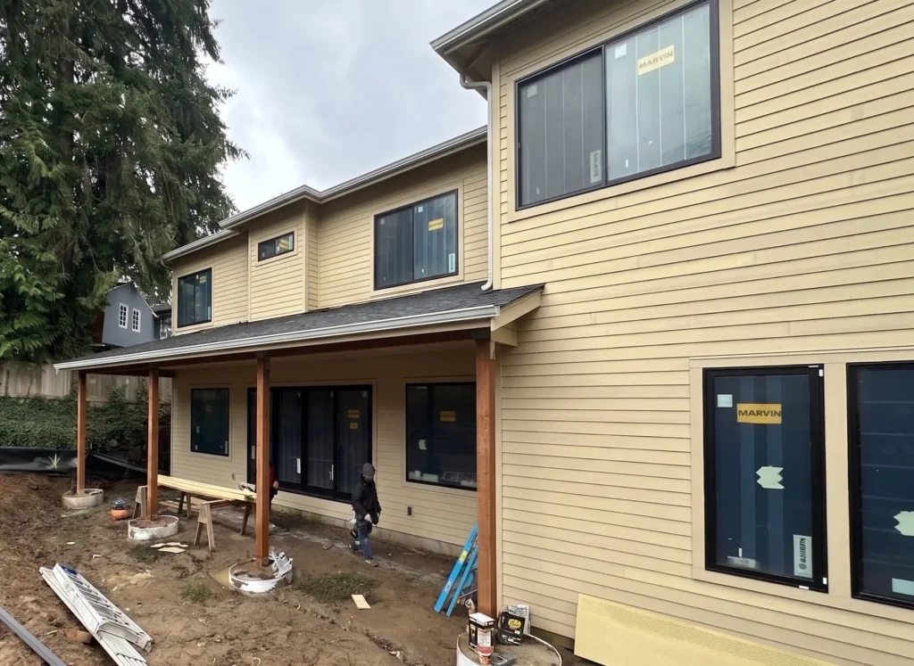 Window flashing integrated into primed James Hardie exterior