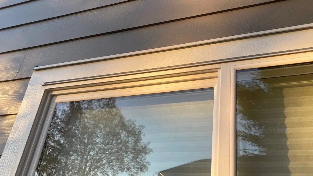 Bellingham project with Arctic White window and door trim; old siding tear-off