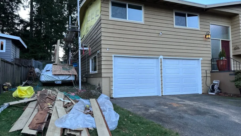 Edmonds project with Old cedar siding tear-off; 45-degree precut outside corners; source says “Stanley steel nails”