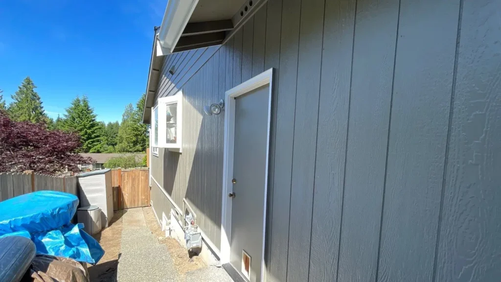 Granite Falls project with Water damage on upper left two panels and rotten spot under rear stairs; 2x8 TK cedar garage casing; 1x4/1x3 cedar corners; cedar vent; two-color paint