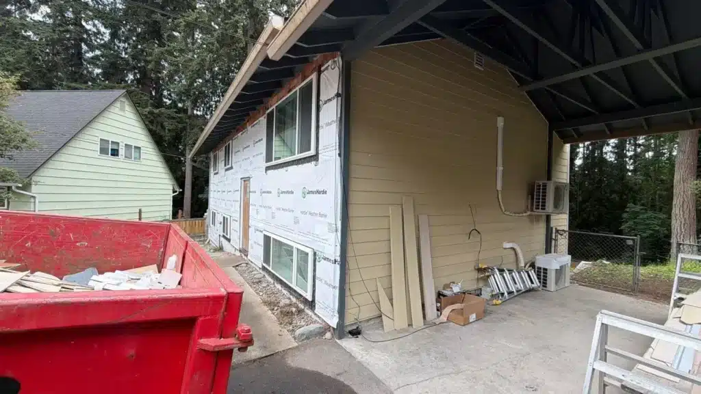 Lynnwood project with 5 1/4x8 lower belly-band detail; documented free rotten plywood repair; two coats Sherwin-Williams SuperPaint satin in two colors