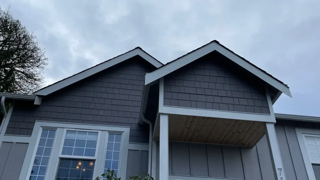 Marysville project with 1x6 pine soffits; Arctic White wraps on rear porch beams/columns; gable fascia work; new white gutters/downspouts; LeafGuard