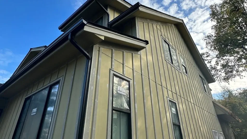 Snohomish project with Straight-edge James Hardie shingles; HardiePanel soffits with 3/8-inch aluminum Tymline channels; 2-inch continuous vents; 1x6 pine T&G entry soffit